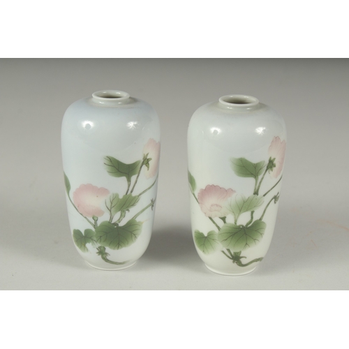 33 - A PAIR OF JAPANESE PORCELAIN VASES, with floral decoration, each with blue mark to base, 11cm high.