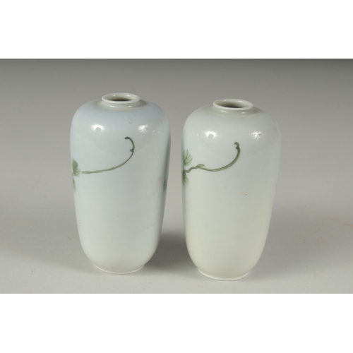 33 - A PAIR OF JAPANESE PORCELAIN VASES, with floral decoration, each with blue mark to base, 11cm high.