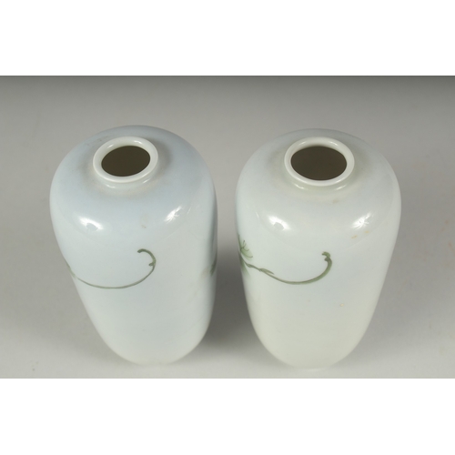 33 - A PAIR OF JAPANESE PORCELAIN VASES, with floral decoration, each with blue mark to base, 11cm high.