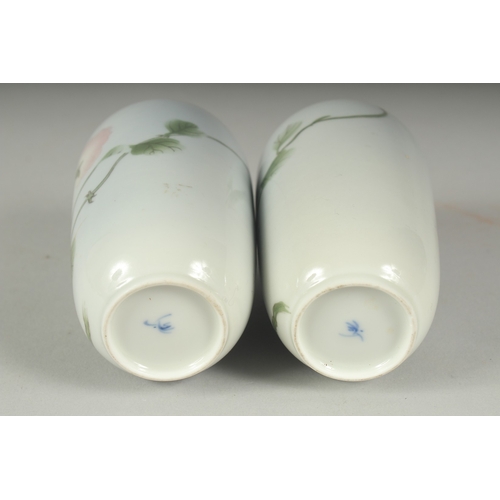 33 - A PAIR OF JAPANESE PORCELAIN VASES, with floral decoration, each with blue mark to base, 11cm high.