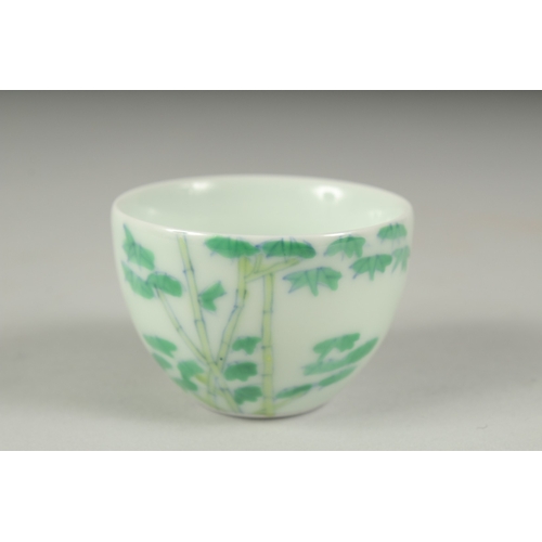 34 - A CHINESE FAMILLE VERTE PORCELAIN CUP, decorated with bamboo, character mark to base. 6cm diameter.