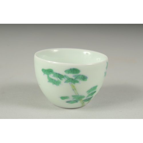 34 - A CHINESE FAMILLE VERTE PORCELAIN CUP, decorated with bamboo, character mark to base. 6cm diameter.