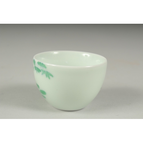 34 - A CHINESE FAMILLE VERTE PORCELAIN CUP, decorated with bamboo, character mark to base. 6cm diameter.