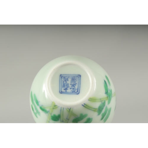 34 - A CHINESE FAMILLE VERTE PORCELAIN CUP, decorated with bamboo, character mark to base. 6cm diameter.