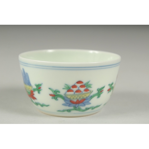 36 - A CHINESE DOUCAI PORCELAIN CUP, character mark to base, 7cm diameter.