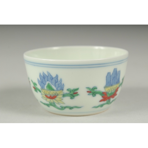 36 - A CHINESE DOUCAI PORCELAIN CUP, character mark to base, 7cm diameter.