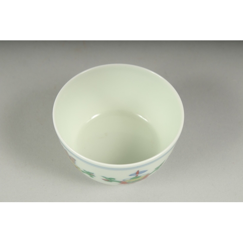 36 - A CHINESE DOUCAI PORCELAIN CUP, character mark to base, 7cm diameter.