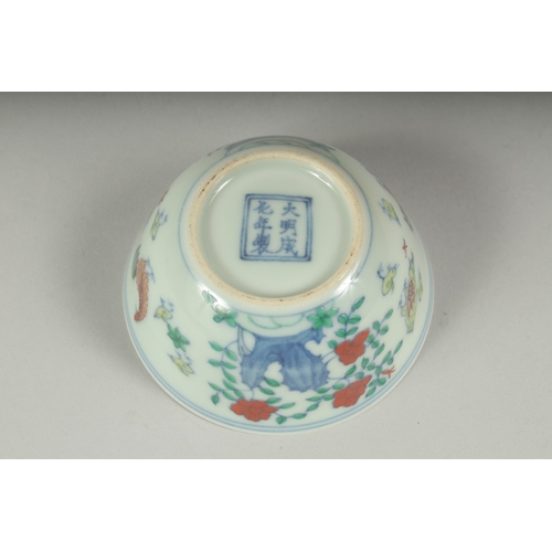 38 - A CHINESE DOUCAI PORCELAIN CHICKEN CUP, 8.5cm diameter.