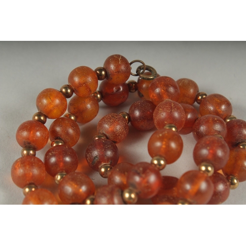 42 - AN AMBER BEADED NECKLACE.