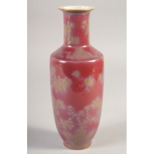 46 - A CHINESE RED GLAZE PORCELAIN VASE, with gilt decoration, the base with six-character mark, 22.5cm h... 