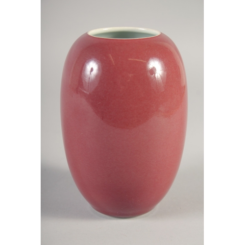 47 - A CHINESE COPPER RED PORCELAIN POT, six-character mark to base, 15cm high.