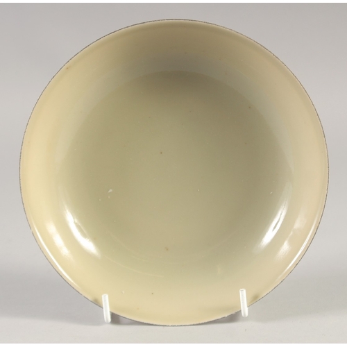 48 - A CHINESE YELLOW GLAZE PORCELAIN DISH, six-character mark to base, 17.5cm diameter.