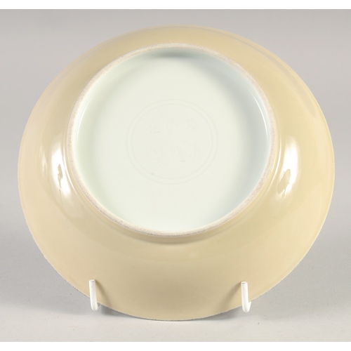 48 - A CHINESE YELLOW GLAZE PORCELAIN DISH, six-character mark to base, 17.5cm diameter.