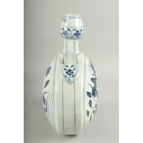 494 - A CHINESE BLUE AND WHITE PORCELAIN TWIN HANDLE MOON FLASK, 31cm high.