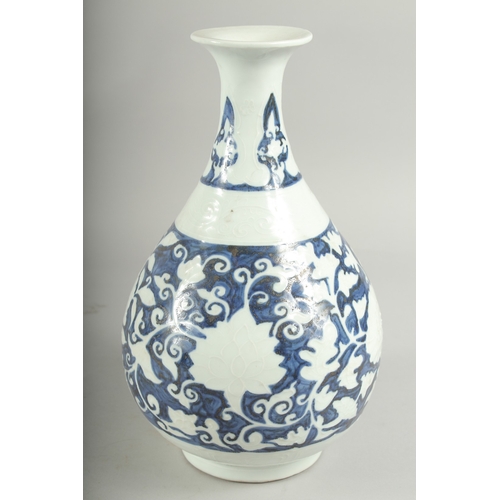 495 - A CHINESE BLUE AND WHITE PORCELAIN VASE, with white floral decoration, character mark to base, 29.5c... 