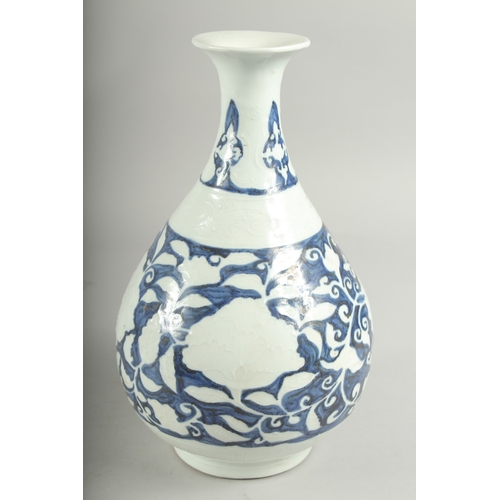 495 - A CHINESE BLUE AND WHITE PORCELAIN VASE, with white floral decoration, character mark to base, 29.5c... 