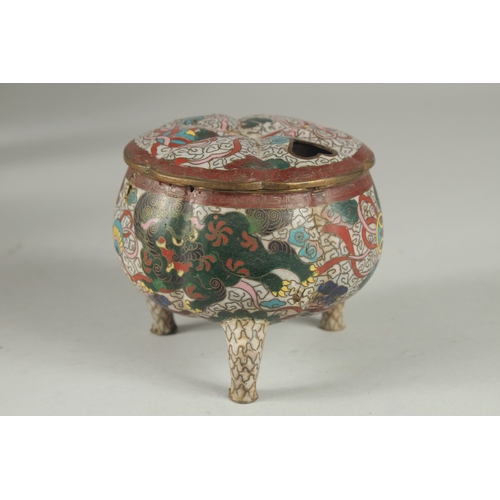 5 - A CLOISONNE TRIPOD CENSER AND COVER, decorated with foo dogs and stylised clouds, 10cm high.