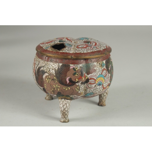 5 - A CLOISONNE TRIPOD CENSER AND COVER, decorated with foo dogs and stylised clouds, 10cm high.