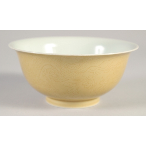 50 - A CHINESE YELLOW GLAZE PORCELAIN DRAGON BOWL, six-character mark to base, 14.5cm diameter.