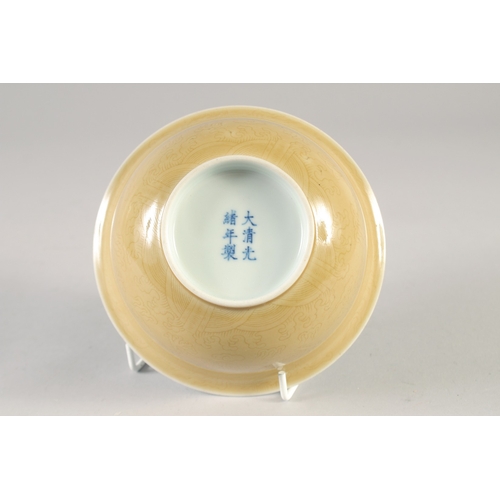 50 - A CHINESE YELLOW GLAZE PORCELAIN DRAGON BOWL, six-character mark to base, 14.5cm diameter.