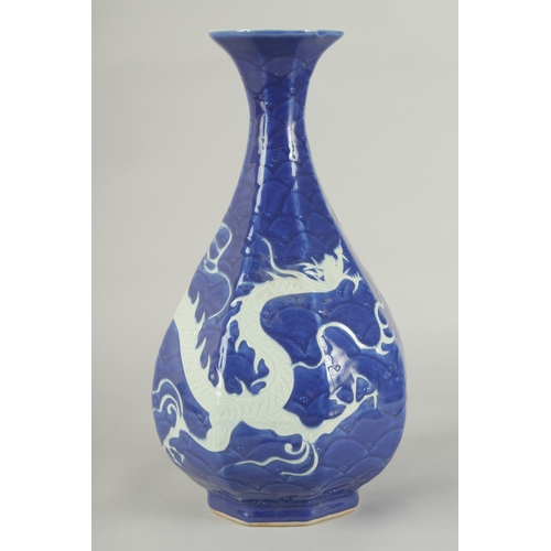 53 - A CHINESE SACRIFICIAL BLUE AND WHITE PORCELAIN DRAGON YUHUCHUNPIN VASE, with carved scale pattern, 3... 