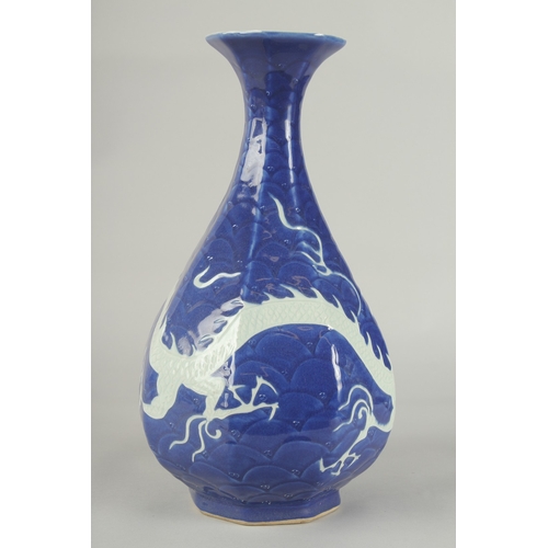 53 - A CHINESE SACRIFICIAL BLUE AND WHITE PORCELAIN DRAGON YUHUCHUNPIN VASE, with carved scale pattern, 3... 