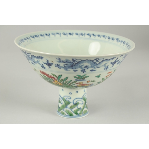 56 - A CHINESE WUCAI PORCELAIN STEM CUP, painted with ducks and aquatic flora, bowl 17cm diameter.