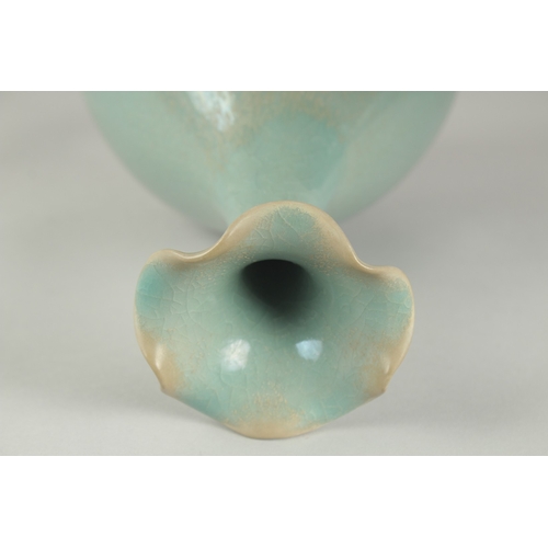 58 - A CHINESE CELADON GLAZE PORCELAIN VASE, with stylised petal-formed rim, 27cm high.