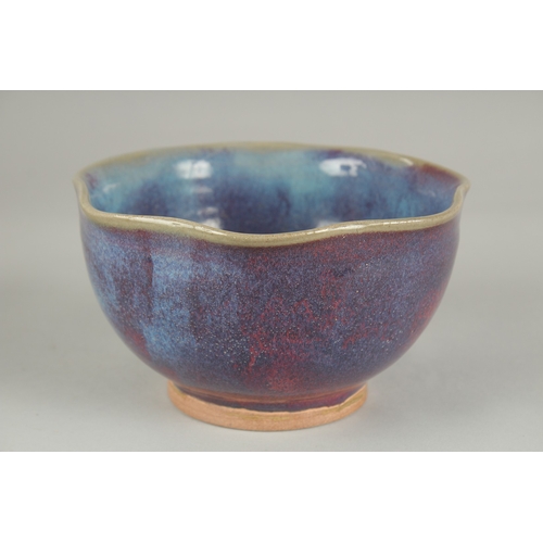 59 - A CHINESE JUN WARE PORCELAIN BOWL, with wavey rim, 16.5cm wide.