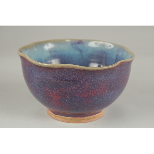 59 - A CHINESE JUN WARE PORCELAIN BOWL, with wavey rim, 16.5cm wide.