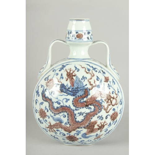 65 - A CHINESE BLUE AND UNDERGLAZE RED PORCELAIN DRAGON MOON FLASK, 30cm high.