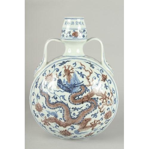 65 - A CHINESE BLUE AND UNDERGLAZE RED PORCELAIN DRAGON MOON FLASK, 30cm high.