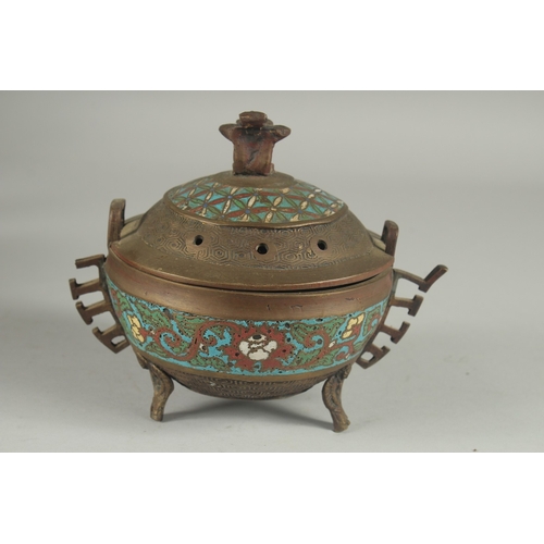 7 - A CHINESE CHAMPLEVE ENAMEL CLOISONNE CENSER AND COVER, raised on tripod legs, 15cm high.