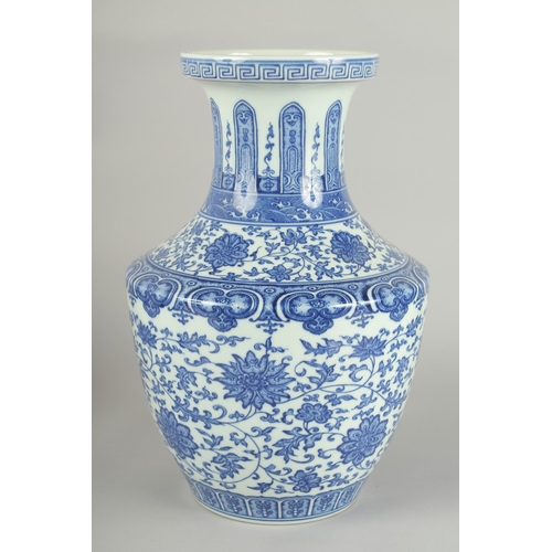 70 - A LARGE CHINESE BLUE AND WHITE PORCELAIN LOTUS VASE, 34cm high.