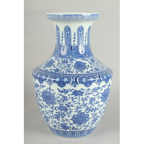 70 - A LARGE CHINESE BLUE AND WHITE PORCELAIN LOTUS VASE, 34cm high.