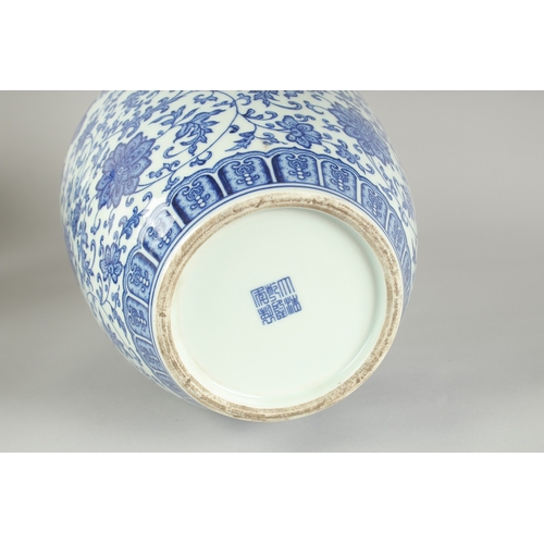 70 - A LARGE CHINESE BLUE AND WHITE PORCELAIN LOTUS VASE, 34cm high.