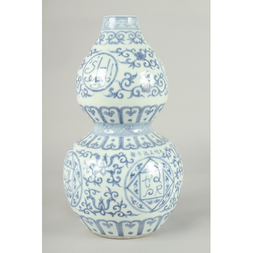 72 - A CHINESE BLUE AND WHITE PORCELAIN DOUBLE GOURD VASE, 32cm high.