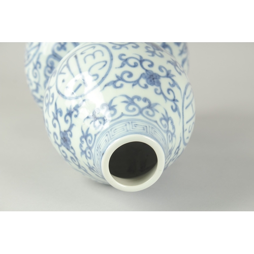 72 - A CHINESE BLUE AND WHITE PORCELAIN DOUBLE GOURD VASE, 32cm high.