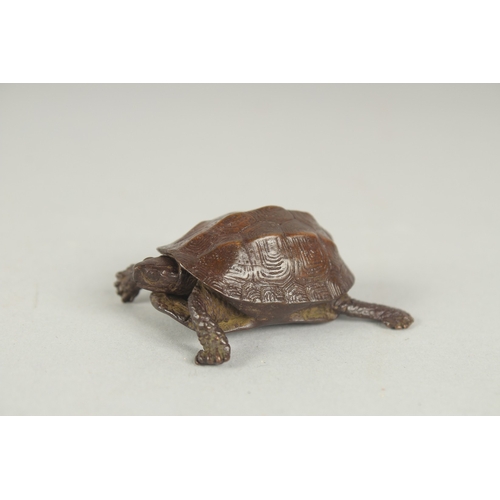 75 - A JAPANESE BRONZE OKIMONO OF A TORTOISE, with retracting head, mark to underside, 5cm long.