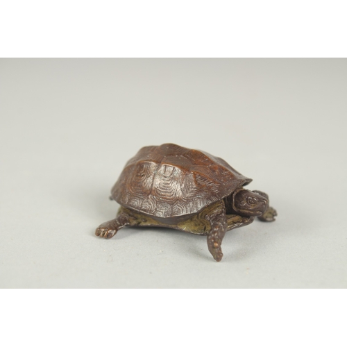 75 - A JAPANESE BRONZE OKIMONO OF A TORTOISE, with retracting head, mark to underside, 5cm long.