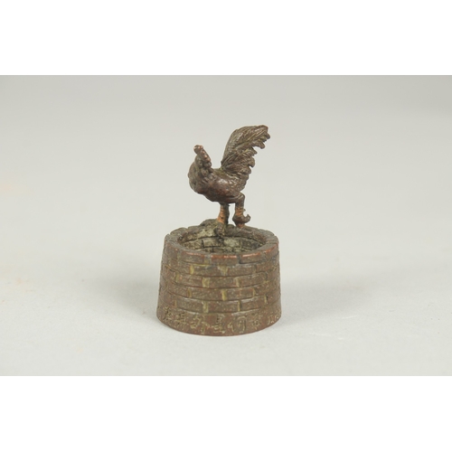 76 - A JAPANESE BRONZE OKIMONO OF CHICKEN, stood upon a well with a toad inside, inscribed to bottom edge... 