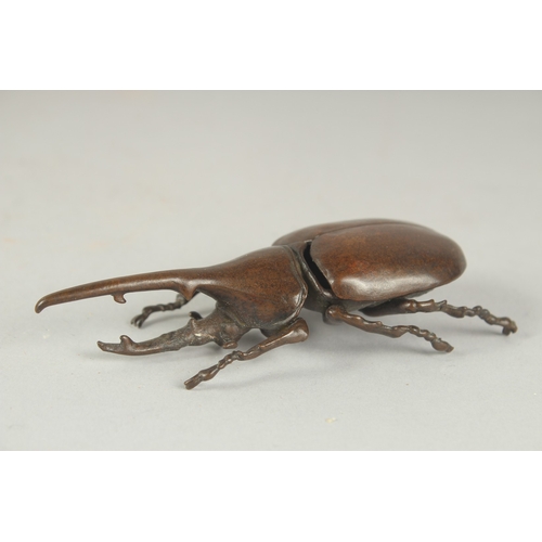 80 - A JAPANESE BRONZE OKIMONO OF A HERCULES BEETLE, with opening back cover, 10.5cm long.