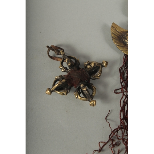 86 - A SMALL TIBETAN FOUR-PRONG VAJRA AND GARUDA HANGING ORNAMENT, (2).