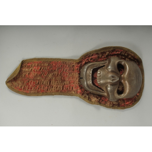 89 - A TIBETAN RITUALISTIC METAL SKULL MASK.