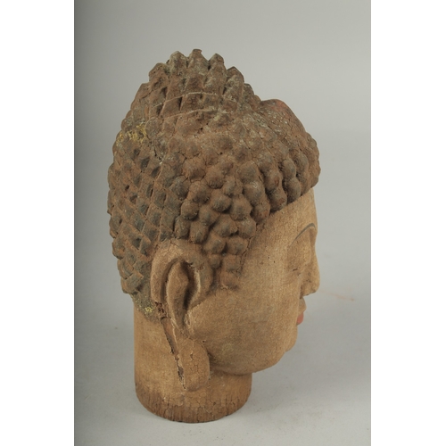 91 - AN ARCHAIC WOOD GUANYIN HEAD, 22cm high.