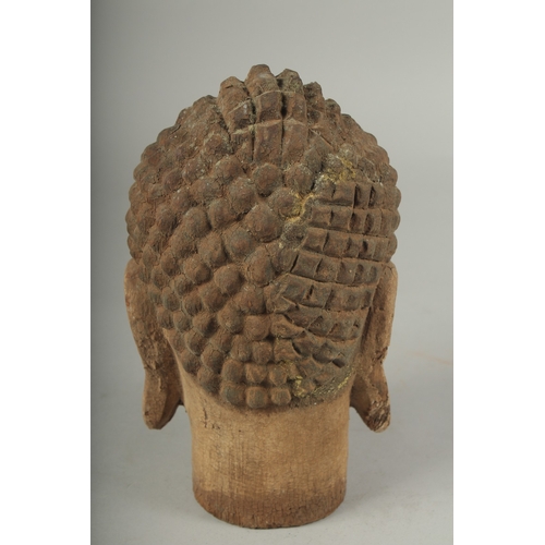 91 - AN ARCHAIC WOOD GUANYIN HEAD, 22cm high.