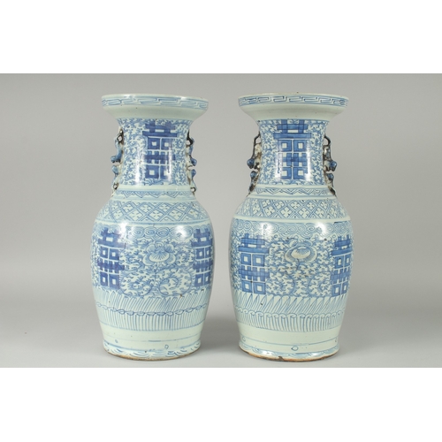 93 - A PAIR OF 19TH CENTURY CHINESE BLUE AND WHITE PORCELAIN VASES, with moulded twin handles in the form... 