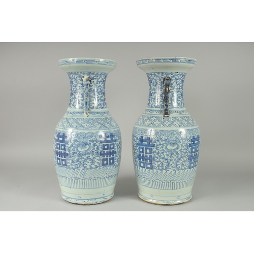 93 - A PAIR OF 19TH CENTURY CHINESE BLUE AND WHITE PORCELAIN VASES, with moulded twin handles in the form... 