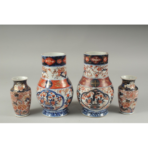 95 - A PAIR OF JAPANESE IMARI PORCELAIN VASES, together with a pair of smaller vases, larger pair 22cm hi... 