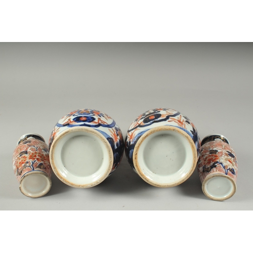 95 - A PAIR OF JAPANESE IMARI PORCELAIN VASES, together with a pair of smaller vases, larger pair 22cm hi... 